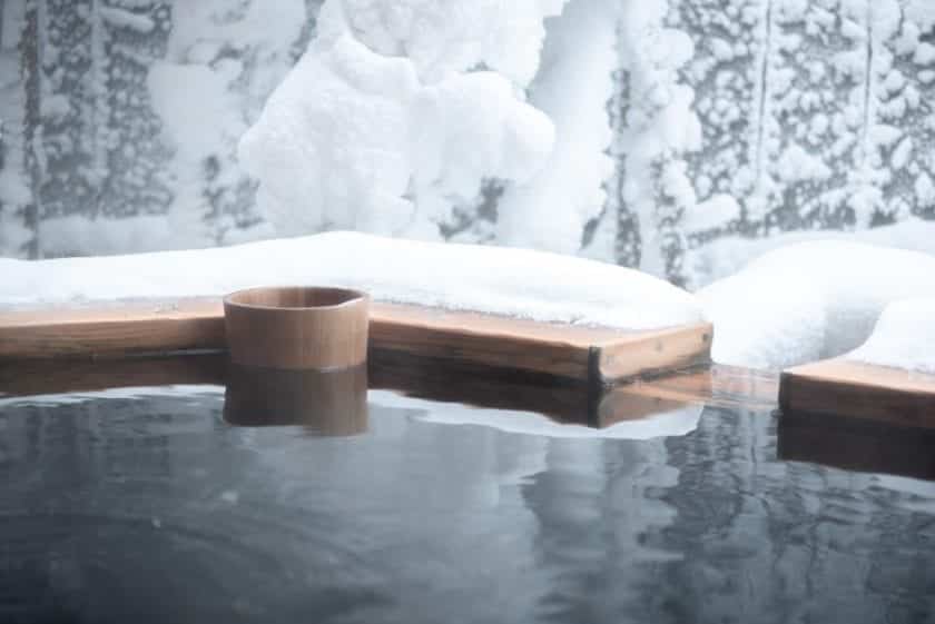 A view of an onsen. Visiting an outdoor hot tub is a perfect bucket list experience in Japan.