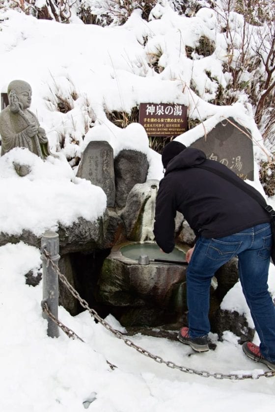 washing hands in a spring in Japan
